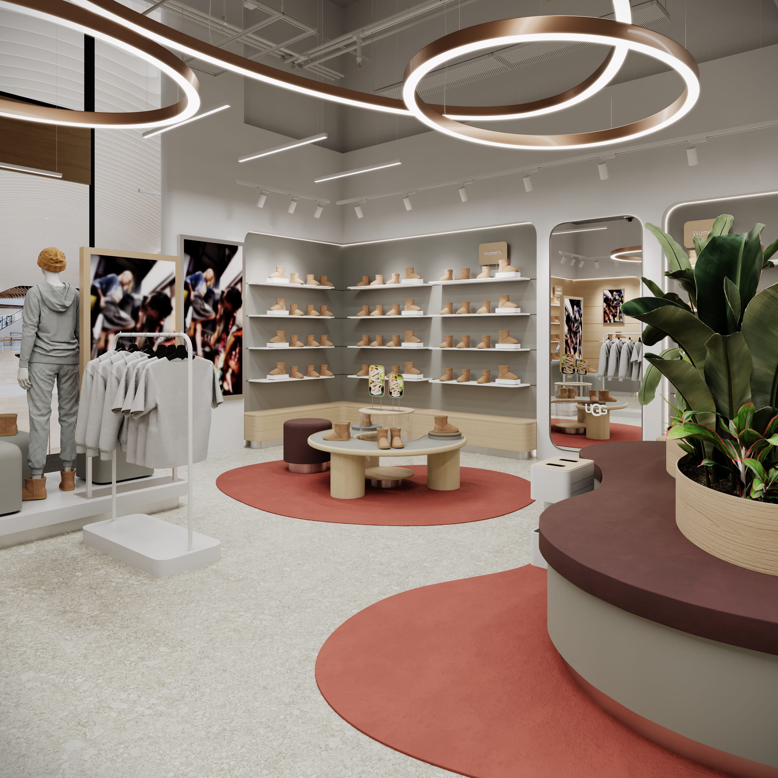 Зона жіночої та чоловічої колекції UGG з настінними полицями та дзеркалами.