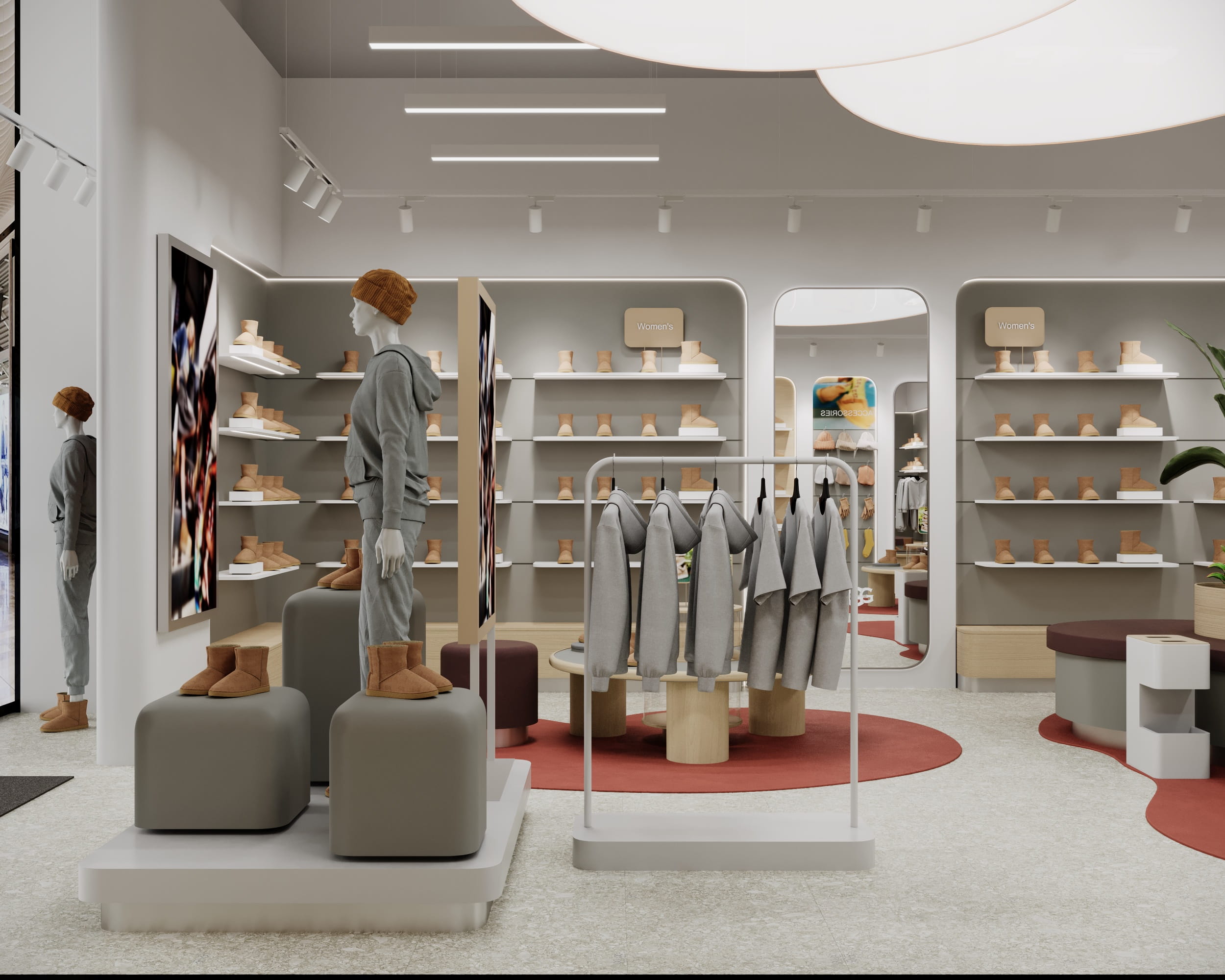 Примірочна магазину UGG з графічною стіновою панеллю та м’яким освітленням.