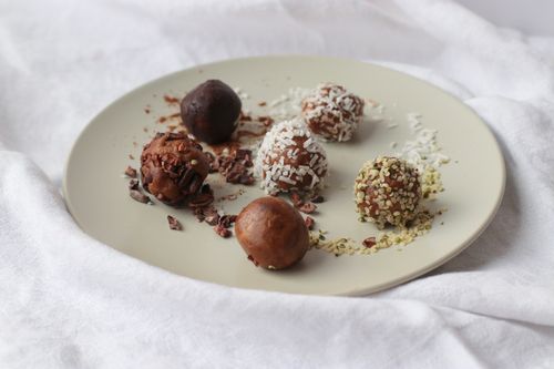 Plate of heathy superfood truffles made during a virtual corporate team activity