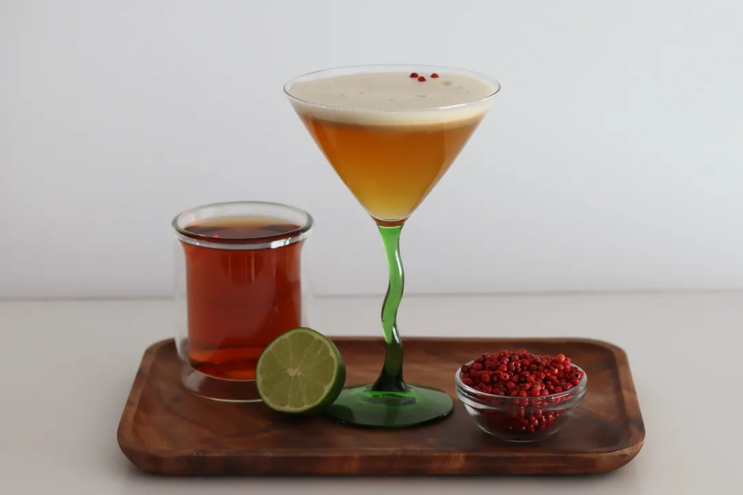 Woman pouring a cocktail during a corporate team building happy hour in the Bay Area