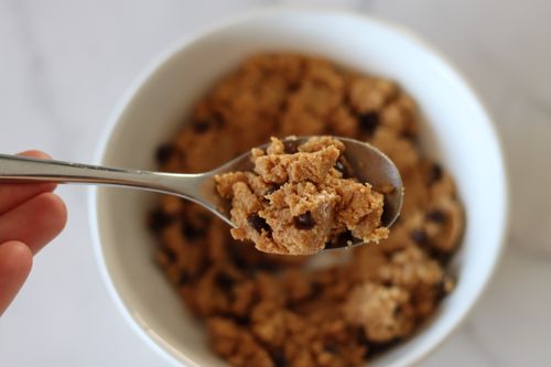 Close-up of a spoonful of cookie dough with chocolate chips, made during a healthy dessert workshop focused on nutritious treats