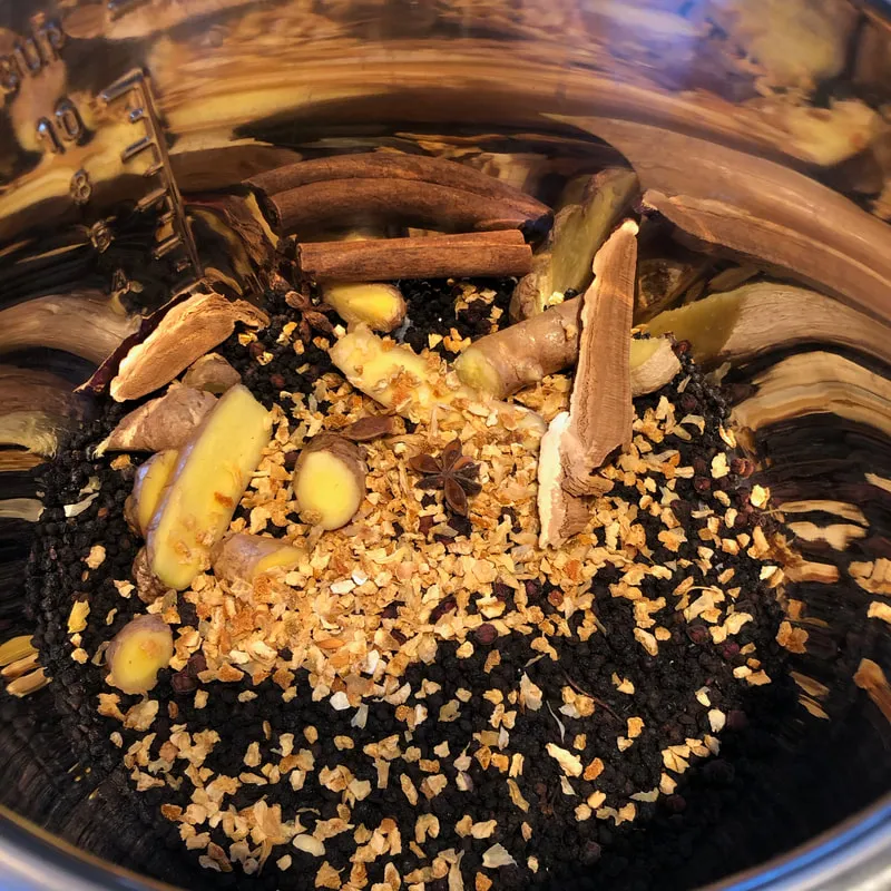 Mix of elderberry syrup spices in a metal bowl