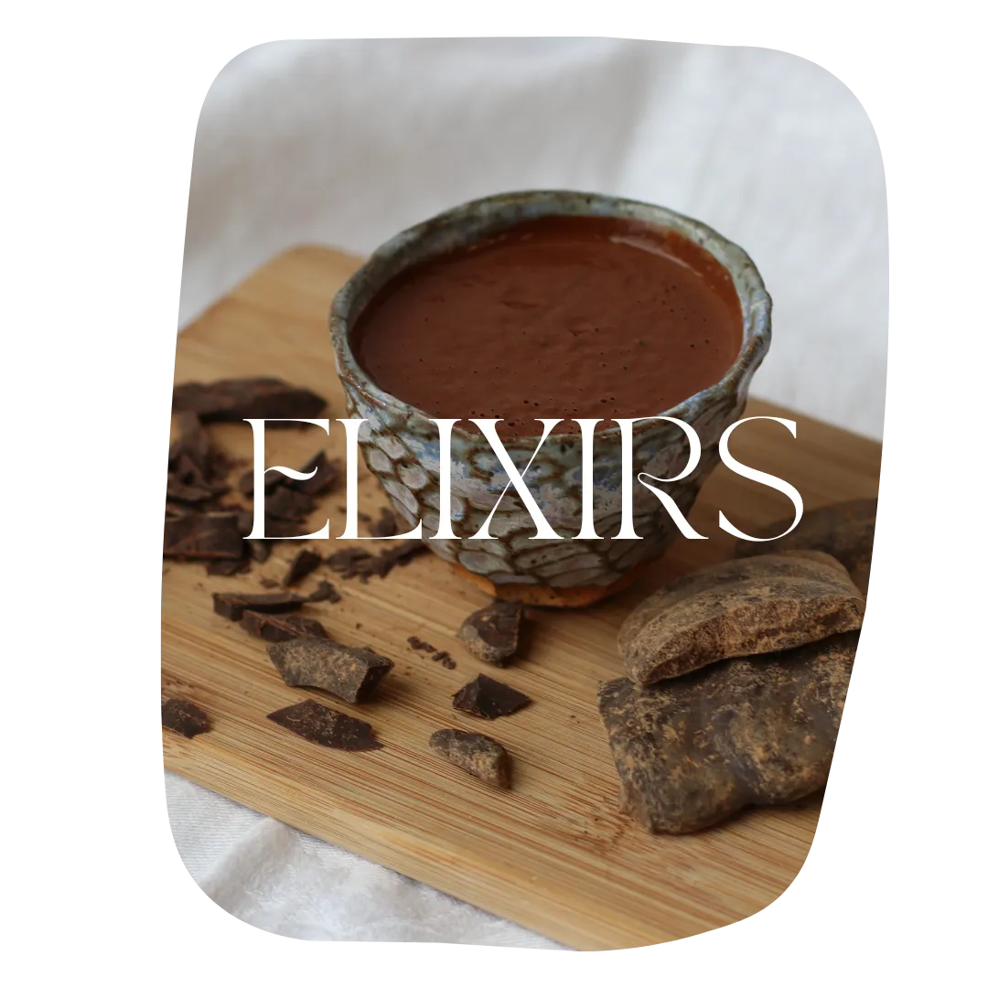 chocolate elixir in ceramic mug with pieces of chocolate on a cutting board from corporate team building workshop