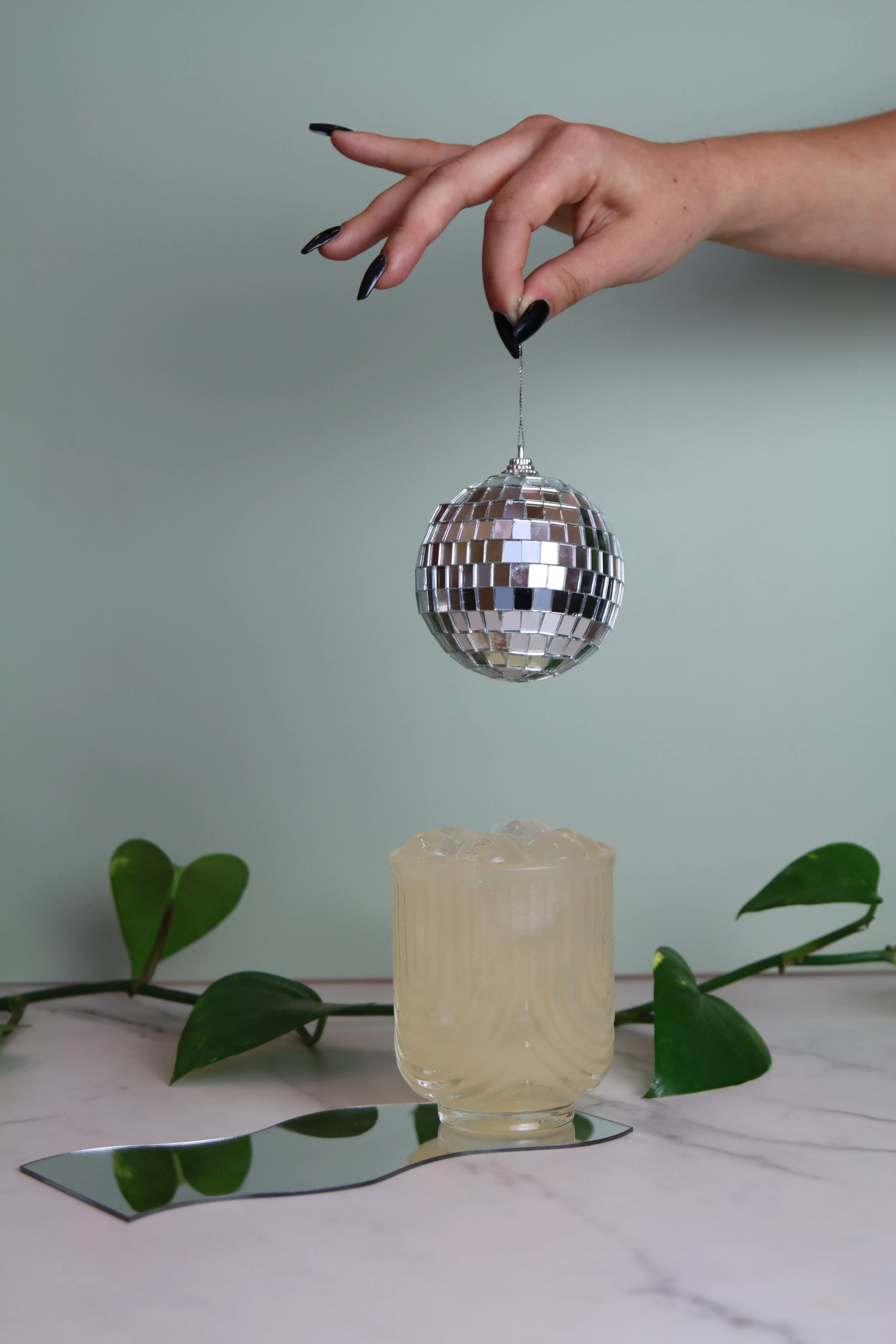 Hand pouring adaptogenic mocktail during corproate event