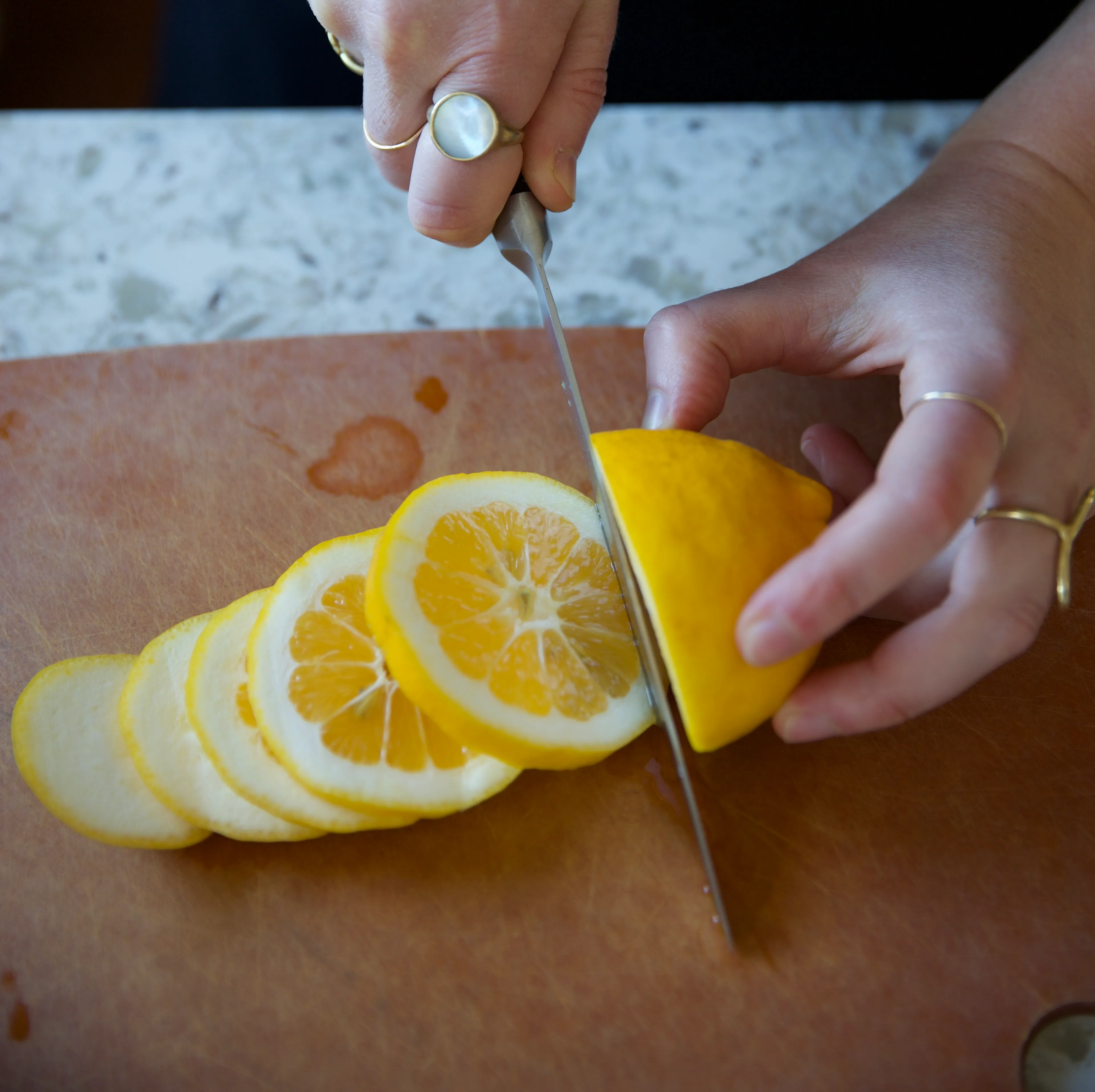 Zero waste lemonade on table with hand holding cup