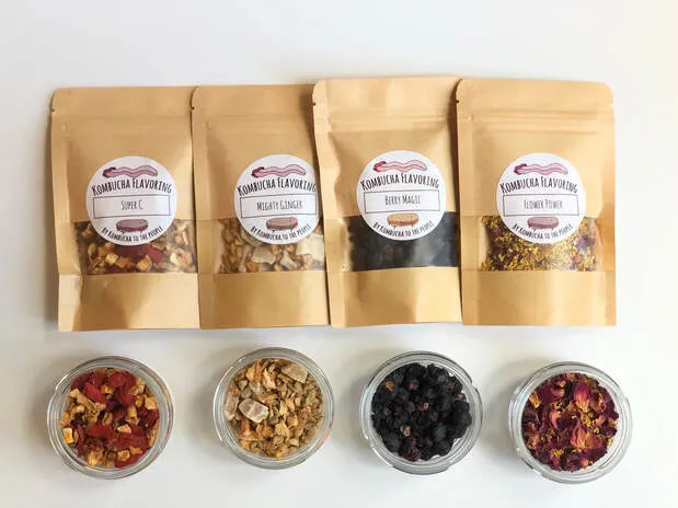 herbal kombucha flavorings for secondary fermentation row of four bags and four jars