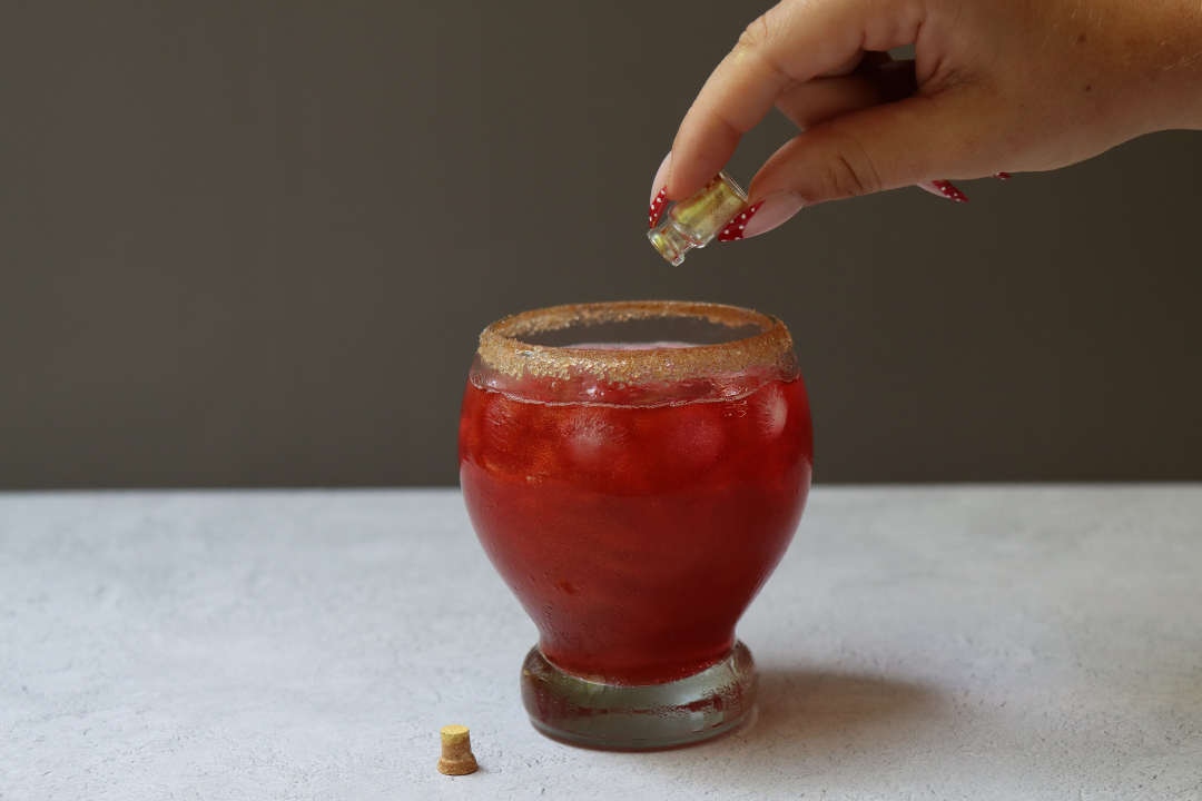 Halloween-themed shimmery red mocktail made for corporate team happy hour