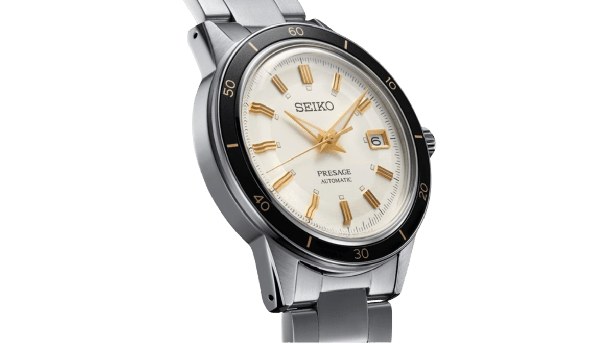 Seiko Presage Style 60s automatic watch with cream dial, gold accents, black bezel, and stainless steel bracelet.
