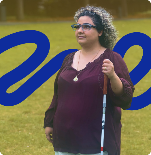 Woman with curly hair wearing sleek Solos smart glasses, holding a white cane while standing on grass. A bold blue wavy graphic overlays the background.