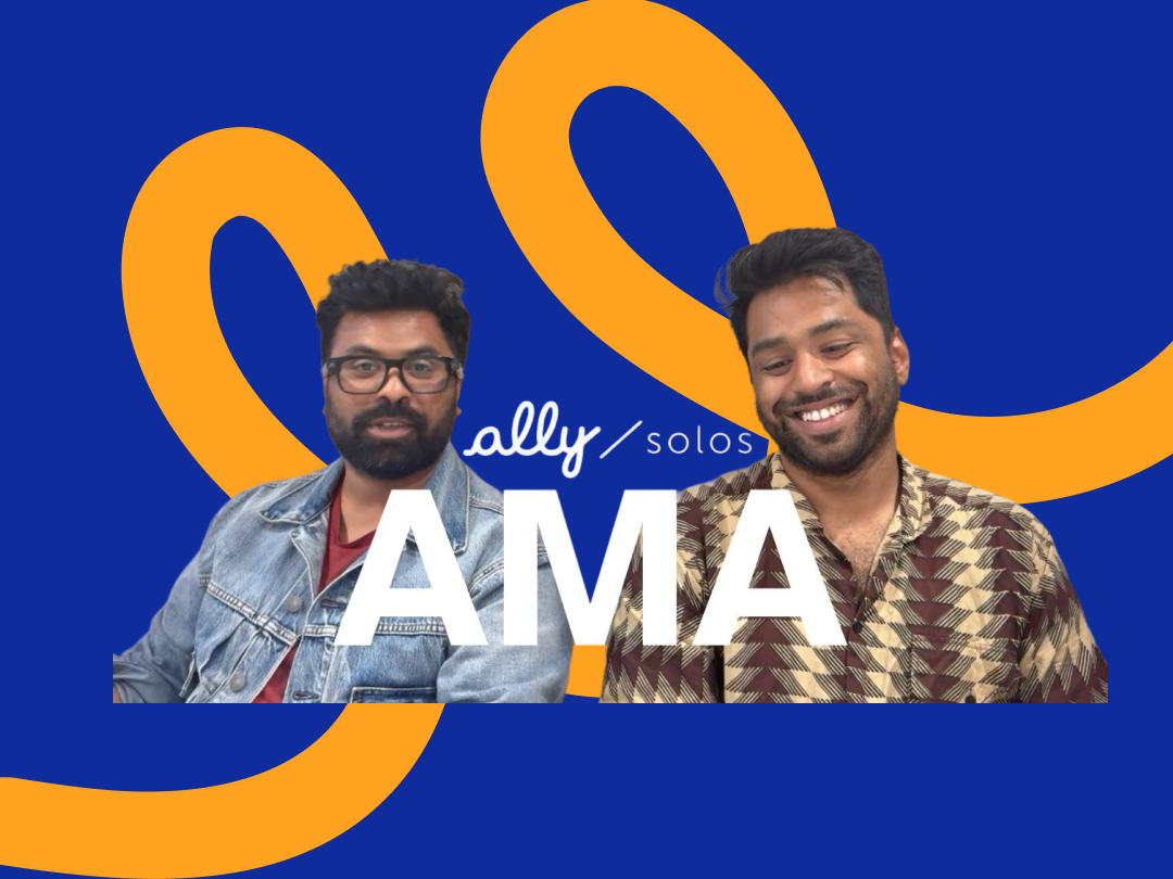 A video still of the two Ally co-founders. One wears the Ally Solos Glasses while they sit in front of a blue background with a large orange pattern. The text "ally solos AMA" is in the foreground.