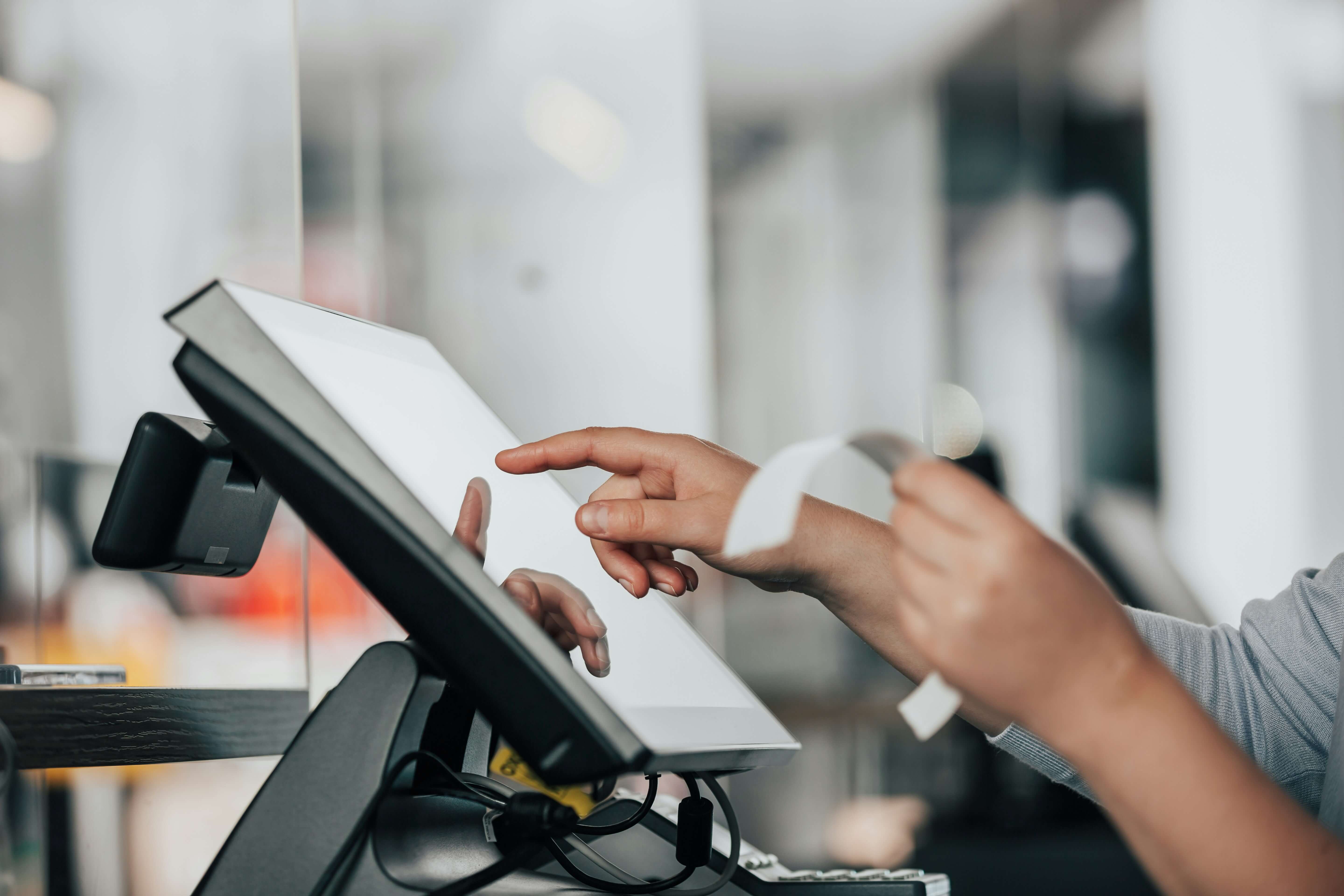 Image for an article about not having a loyalty program. Cash register and applying a loyalty discount