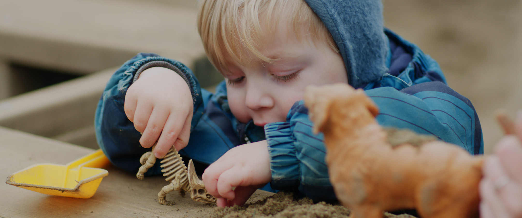 Teacher talking with child.