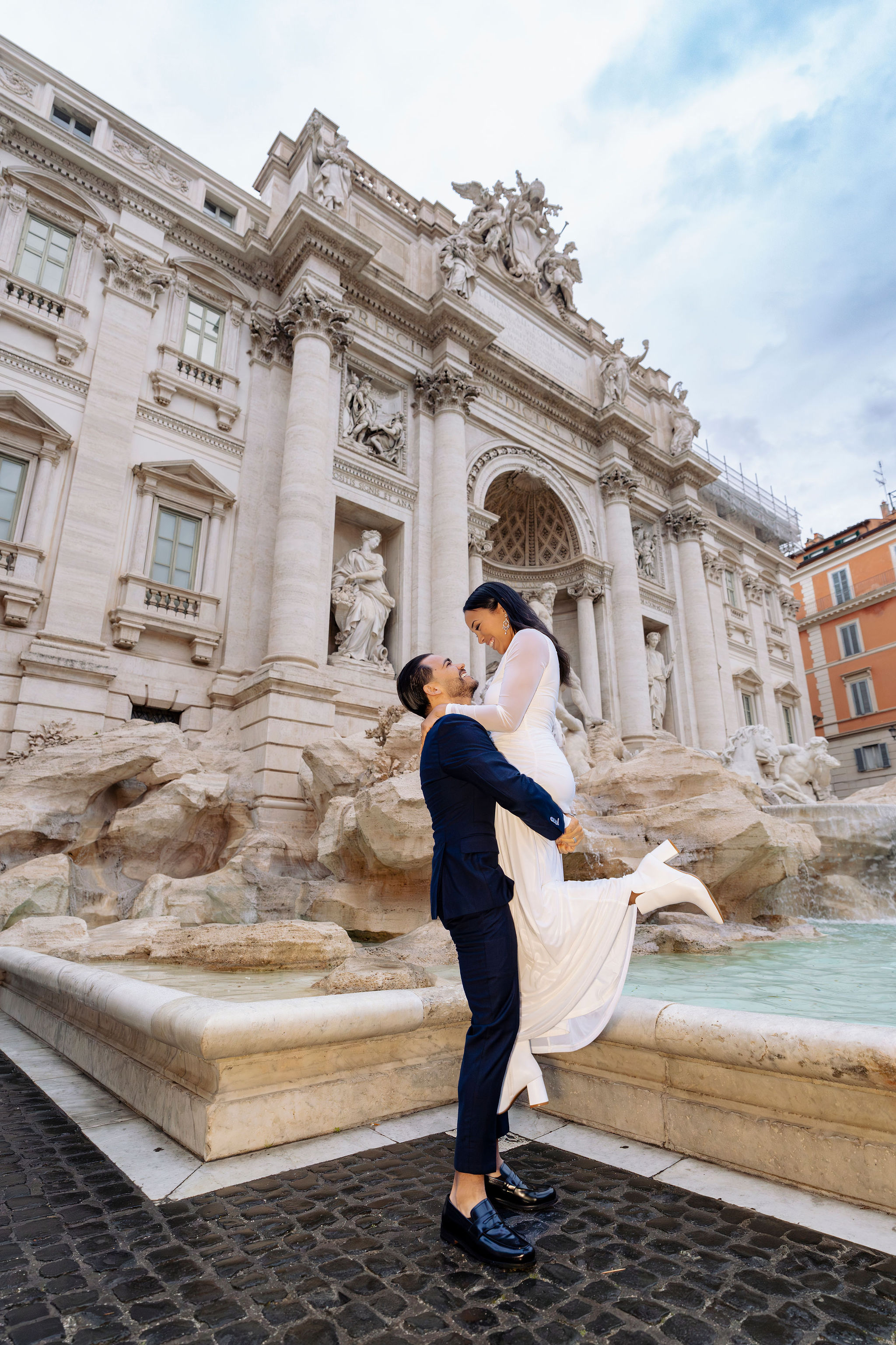 Couple Grand Tour Rome photoshoot at Trevi Fountain, early morning, captured by Eidos Photography, Rome photographer.