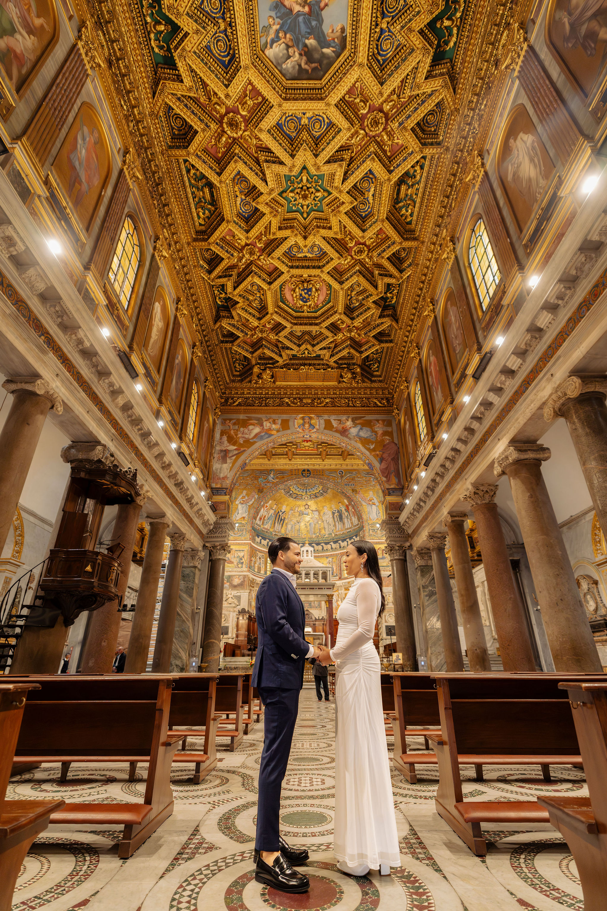 Couple standing face to face inside a historic church in Rome during the Grand Tour Rome Photoshoot by Eidos Photography, Rome photographer.