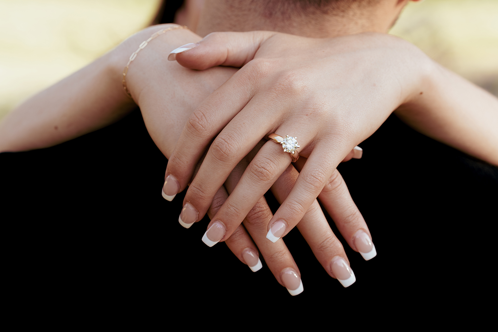 Close up of engagement ring and hands during a Rome proposal photoshoot at Villa Doria Pamphili, captured by Eidos Photography, Rome photographer.