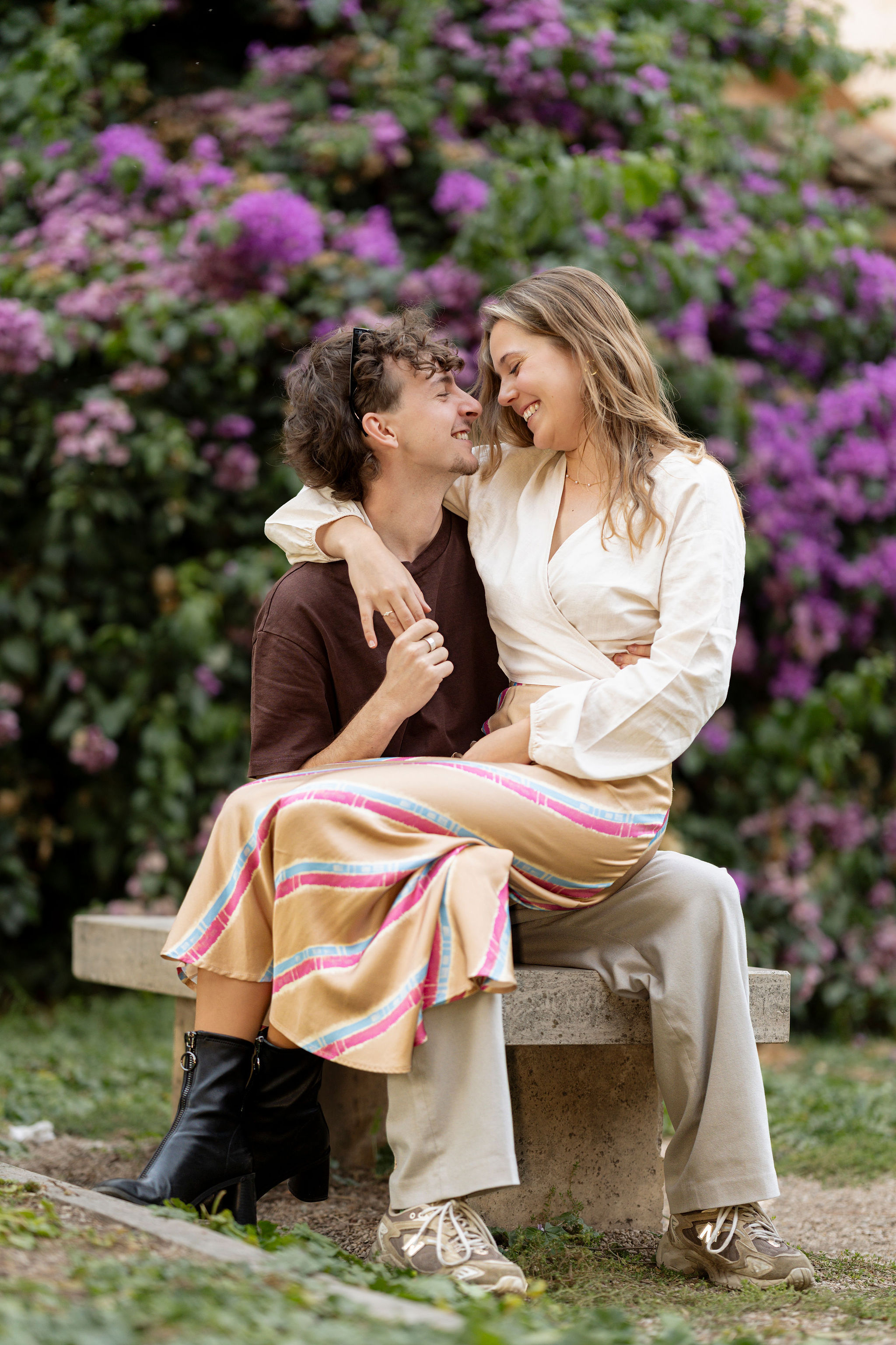 Soft romance in a hidden Aventine garden, framed by seasonal blooms and real laughter. Shot by Eidos Photography, a local Rome photographer for couple and proposal photoshoots.