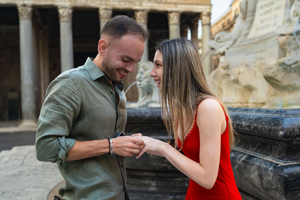 Man proposing in front of the Pantheon, Piazza della Rotonda Rome, romantic engagement moment by Eidos Photography, Rome photographer.
