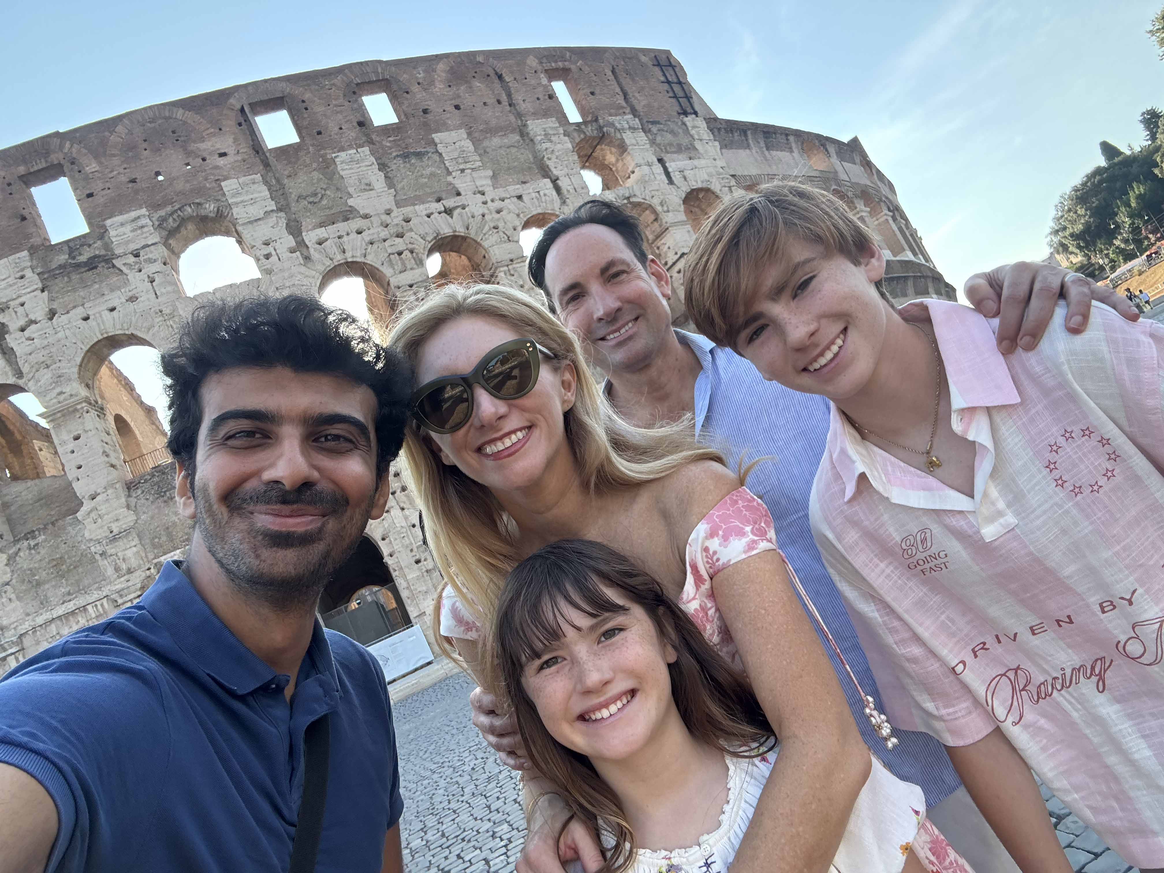 Rome photographer Jeff taking a selfie with a family after their Colosseum photoshoot.