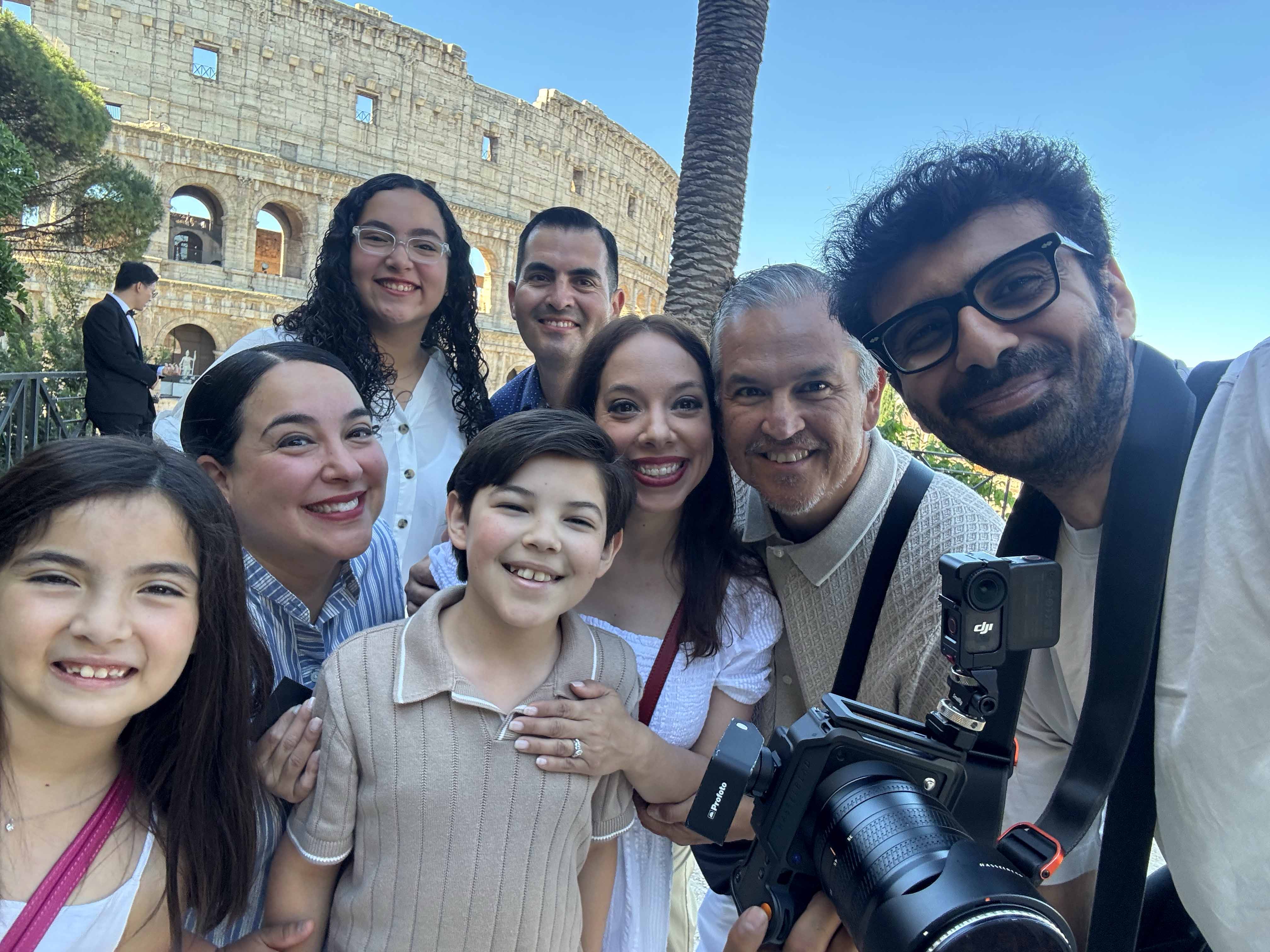 Rome photographer Jeff taking a selfie with a family after their Colosseum photoshoot in Rome.