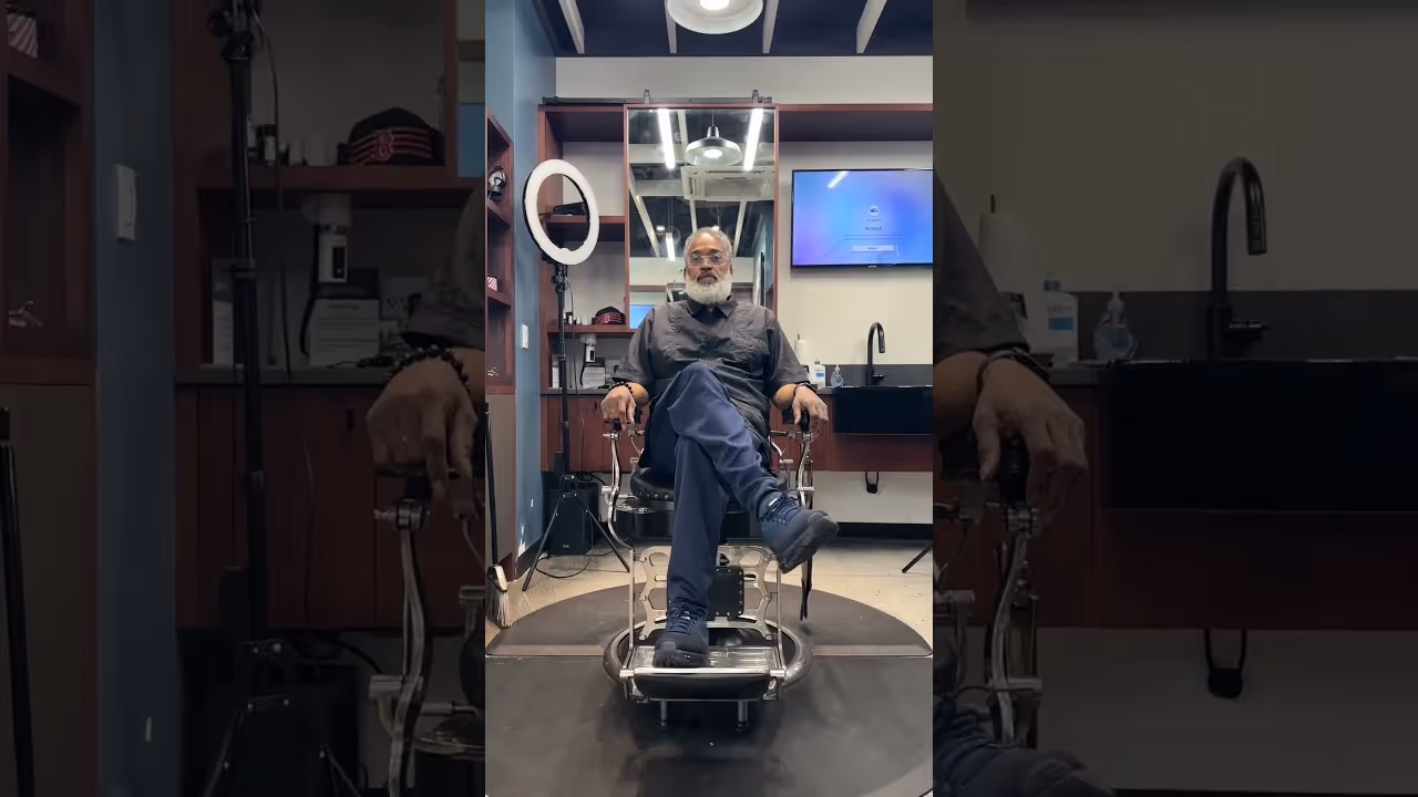 Man sitting on a chair in a barbershop