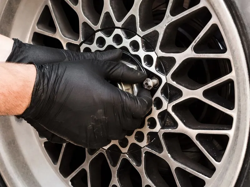 1-800EveryRim employee changing a tire