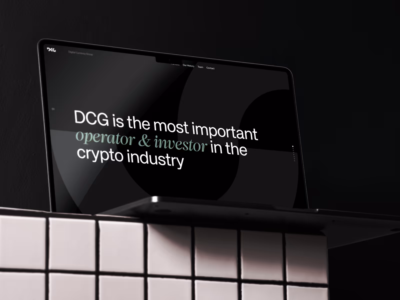 Laptop displaying a webpage with the text 'DCG is the most important operator & investor in the crypto industry' against a dark background.