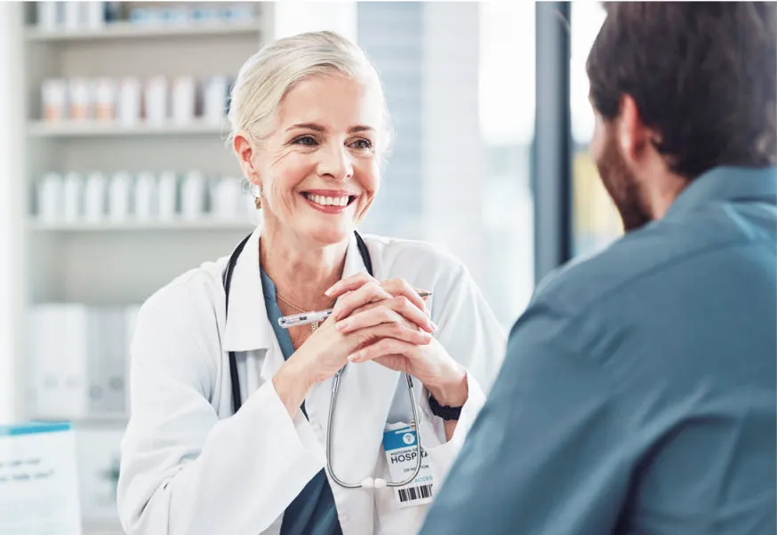 Neurologist conversing with patient