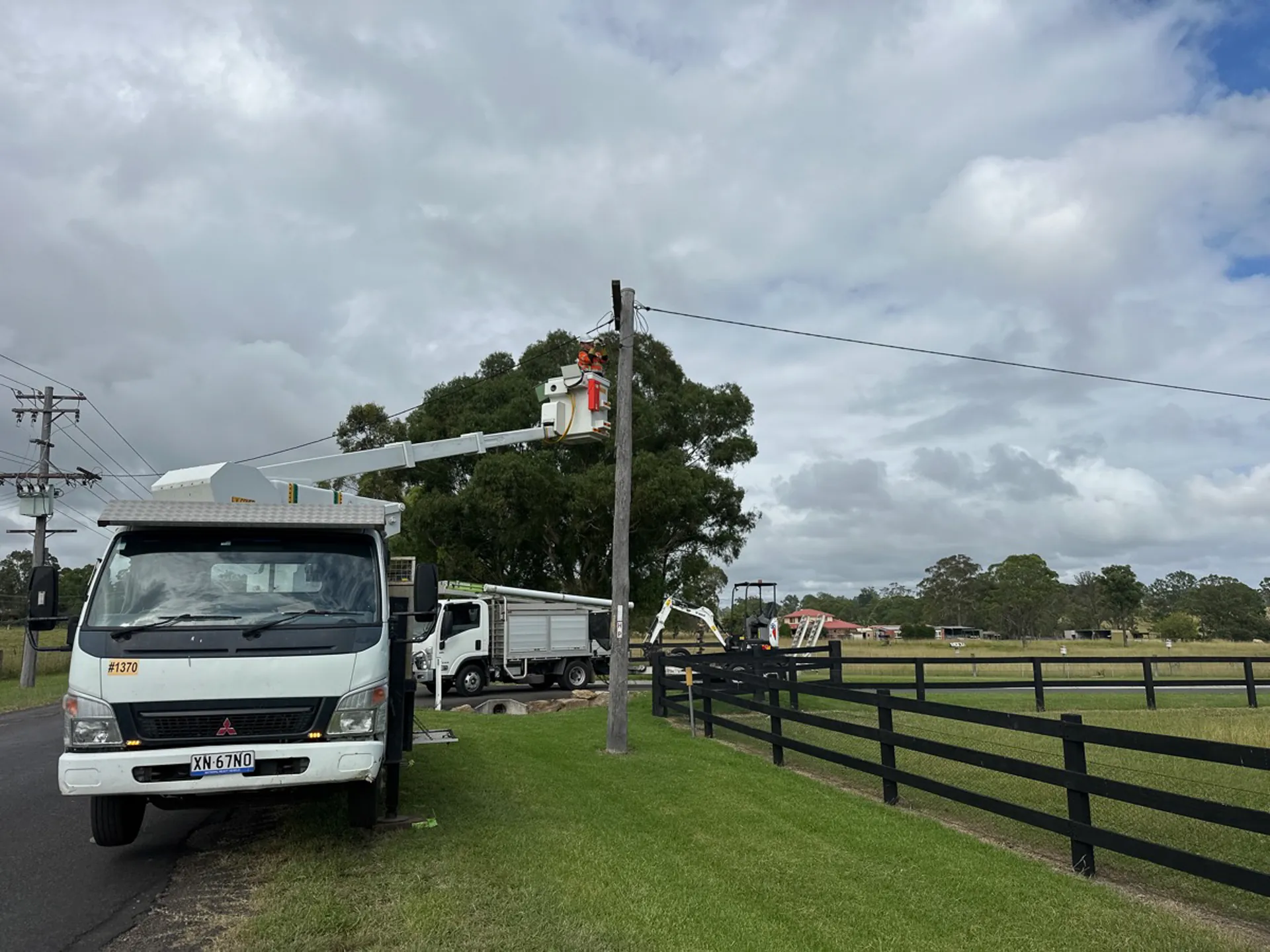 Altiv Electrical elevated work platform truck working on a roadside power pole