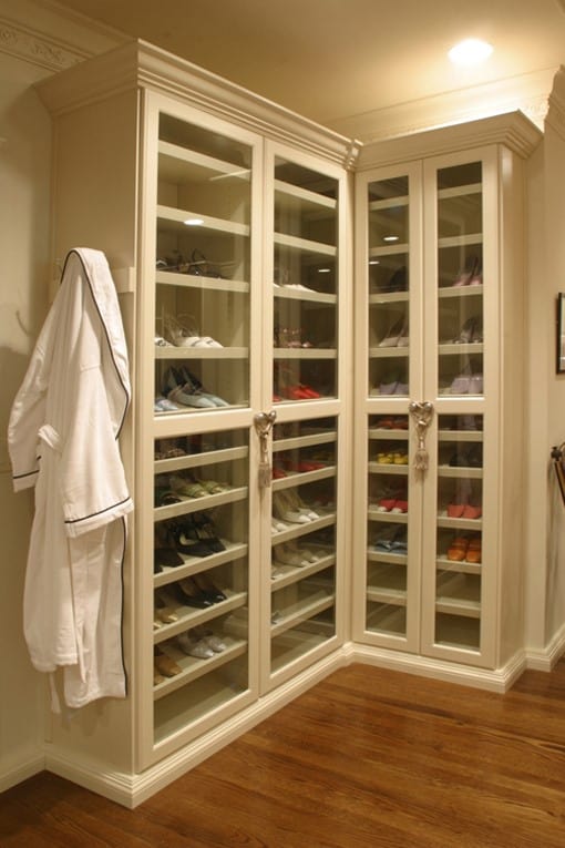 A shoe closet with slanted shoe racks.