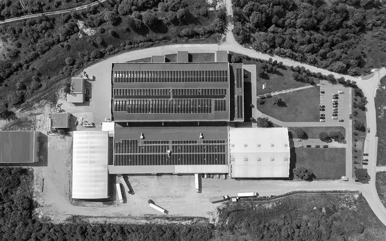 Aerial view of Bigso’s European production facility with solar panels covering the factory roof, showcasing renewable energy use and commitment to sustainable manufacturing in the EU.