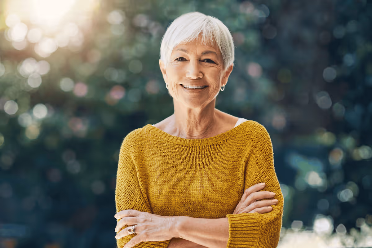 Happy and healthy senior woman with yellow shirt