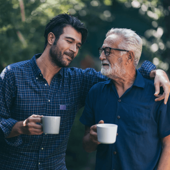 older adult with insomnia and depressive symptoms drinking coffee with son