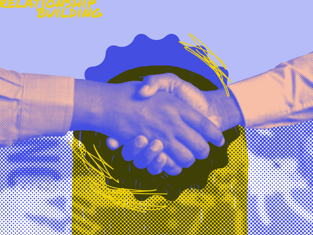 two hands shaking wit "relationship building" in the background
