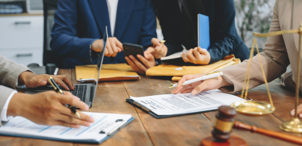 Group of lawyers sitting around a table working