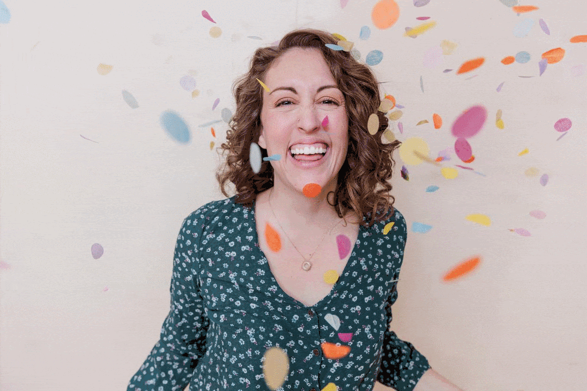 GIF of Rootabl founder Laura Sprinkl smiling with confetting raining down. 