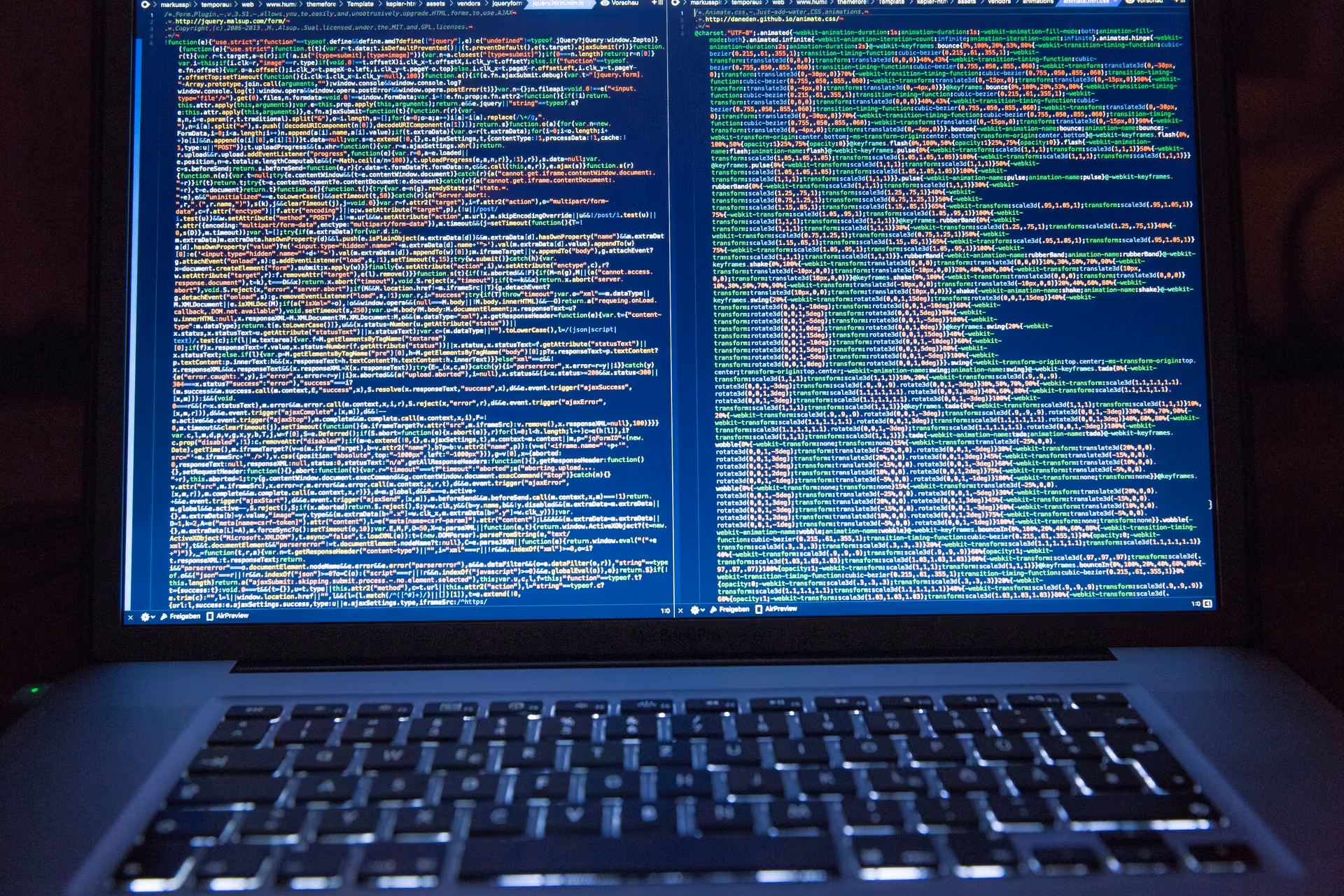 Black Laptop Computer Turned on Showing Computer Codes