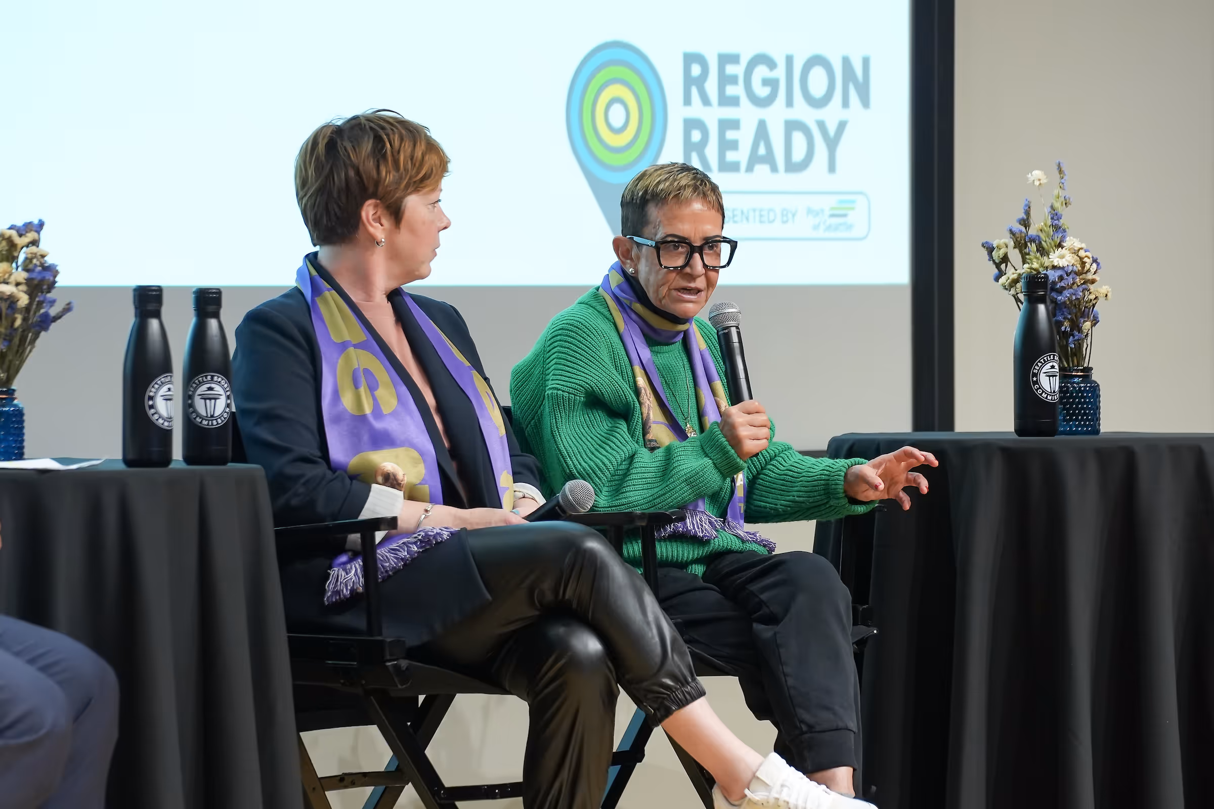 Seattle Sports Commission Women in Leadership Breakfast panelists laughing on stage
