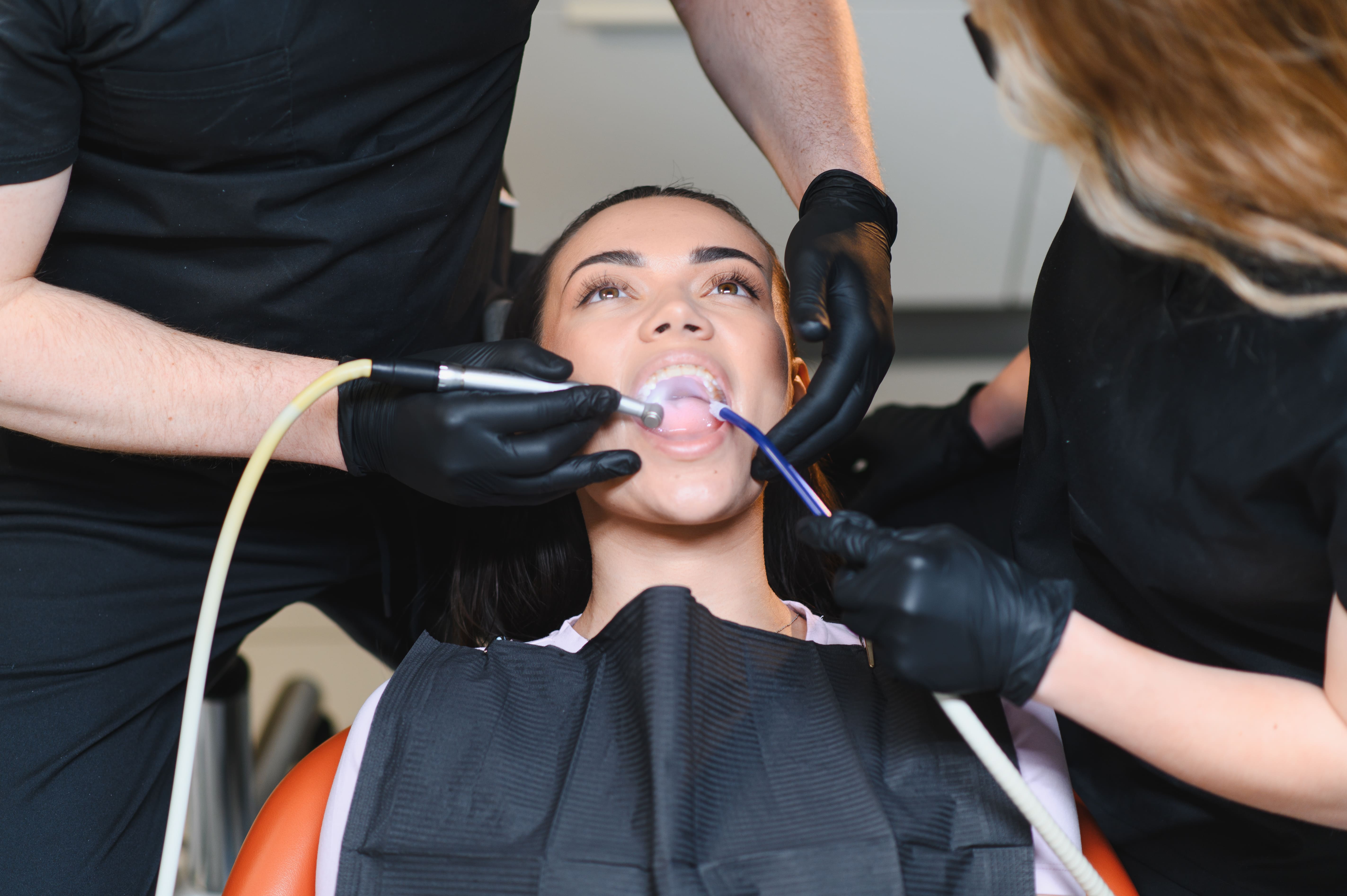 professional-dental-procedure-with-young-woman-in 