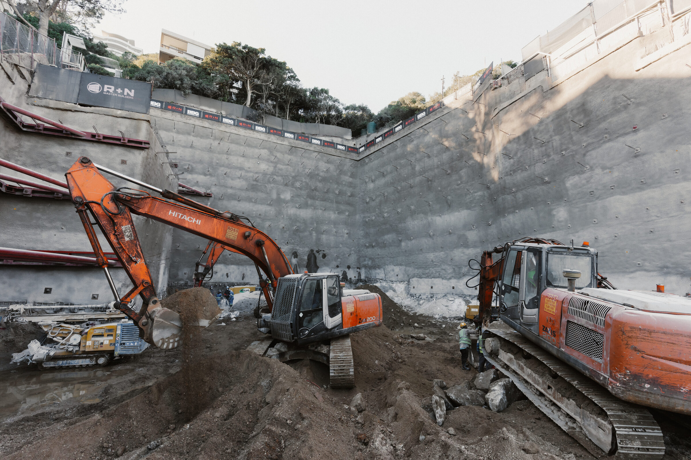 Excavators at work against the anchored retaining walls of the 23 Victoria Road site in Clifton