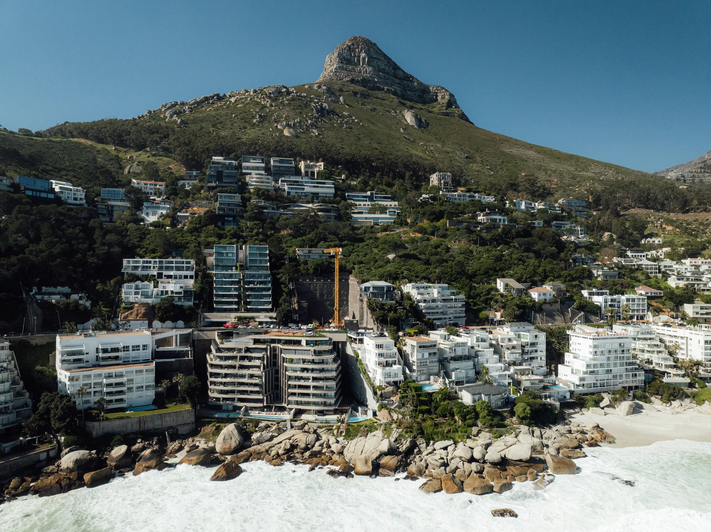 Aerial view of 23 Victoria Road in Clifton, the site set into the slope above the Atlantic with Lion's Head beyond