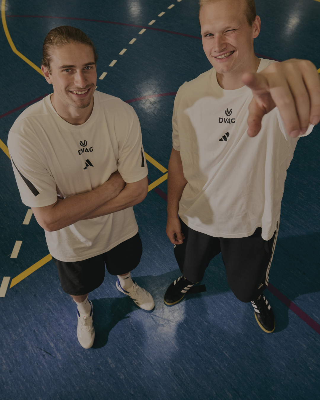 Juri Knorr and David Späth on a handball court