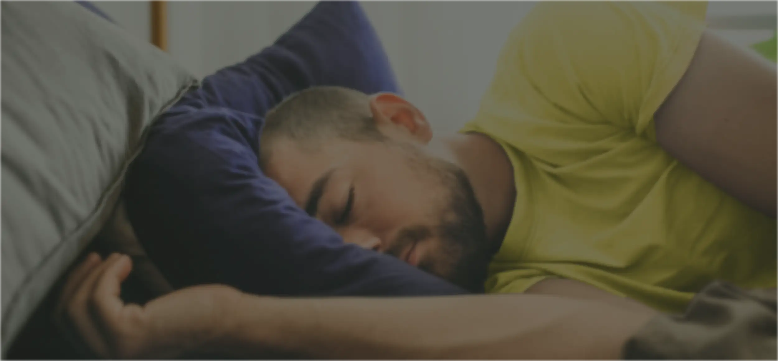 Collage of three images: a person using a smartphone, a black smart ring displayed in a yellow box, and a man sleeping on a pillow.