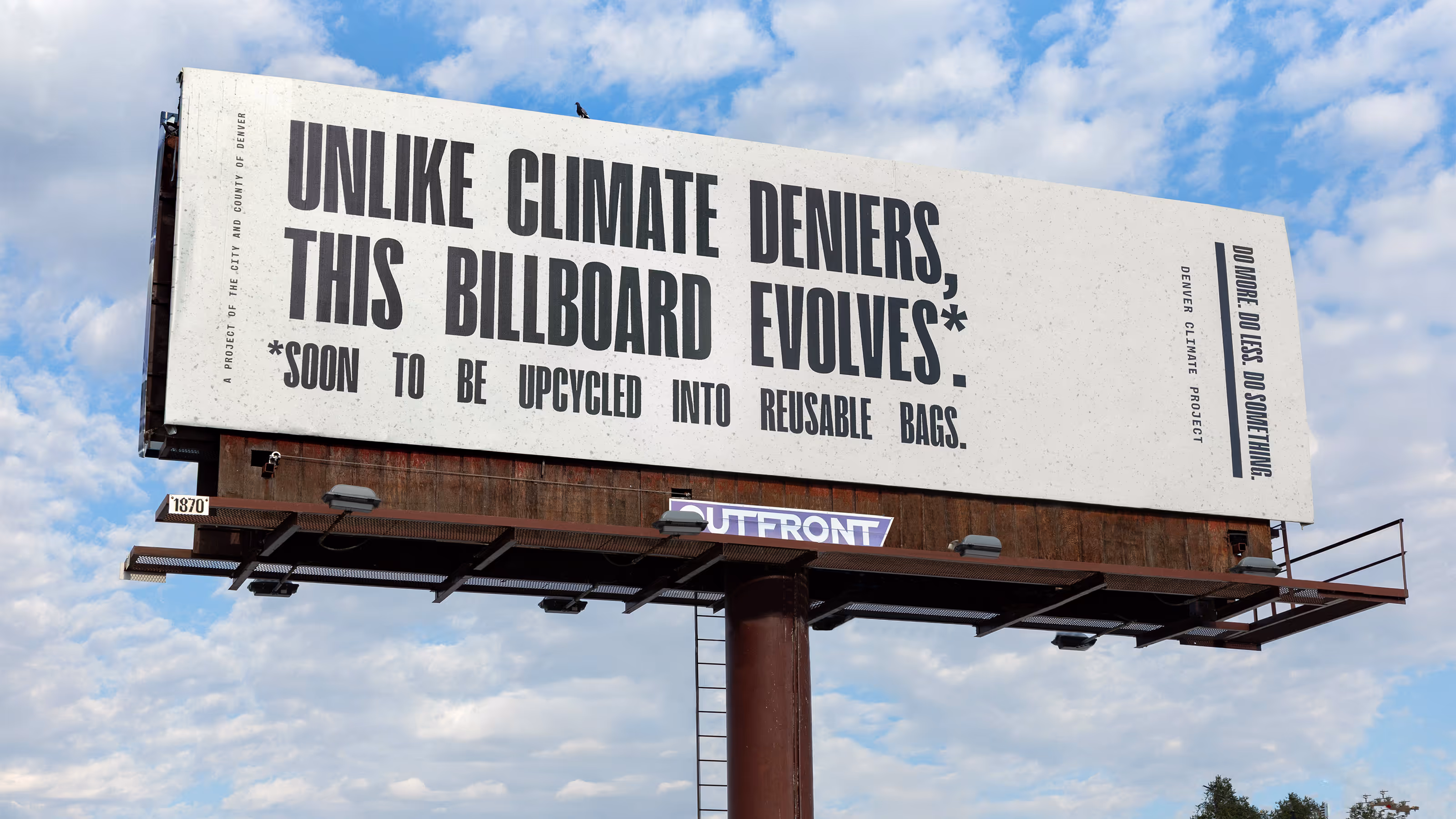 photo of billboard on blue sky and cloud background for the Denver Climate Project.