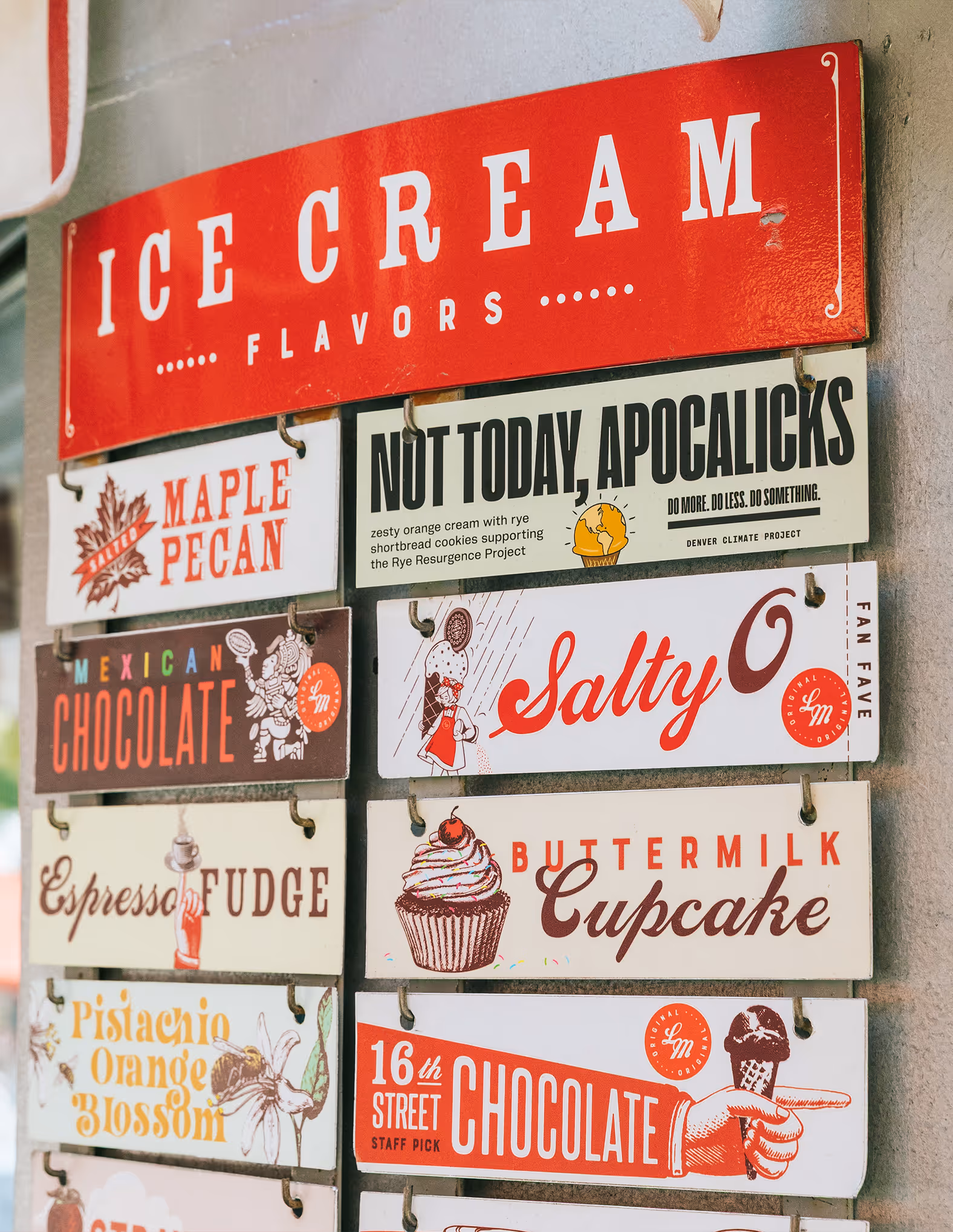 Little man ice cream sign with selection of flavors