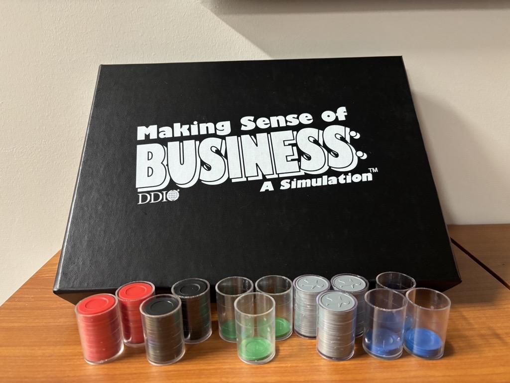 A facilitator working with teams to boost their understanding of how money moves through the business.