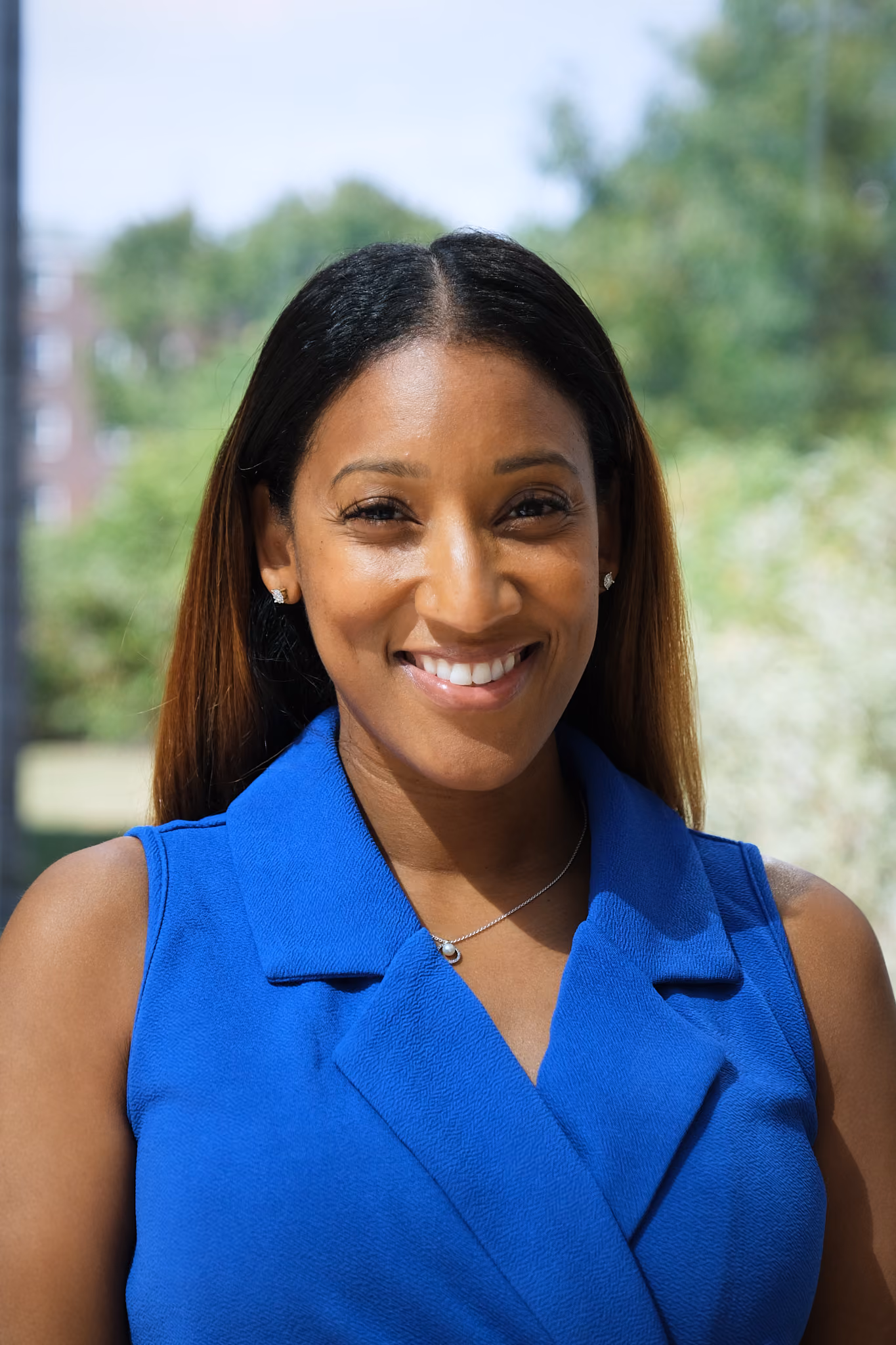 Staff portrait of Maricia Forrester smiling in blue blazer
