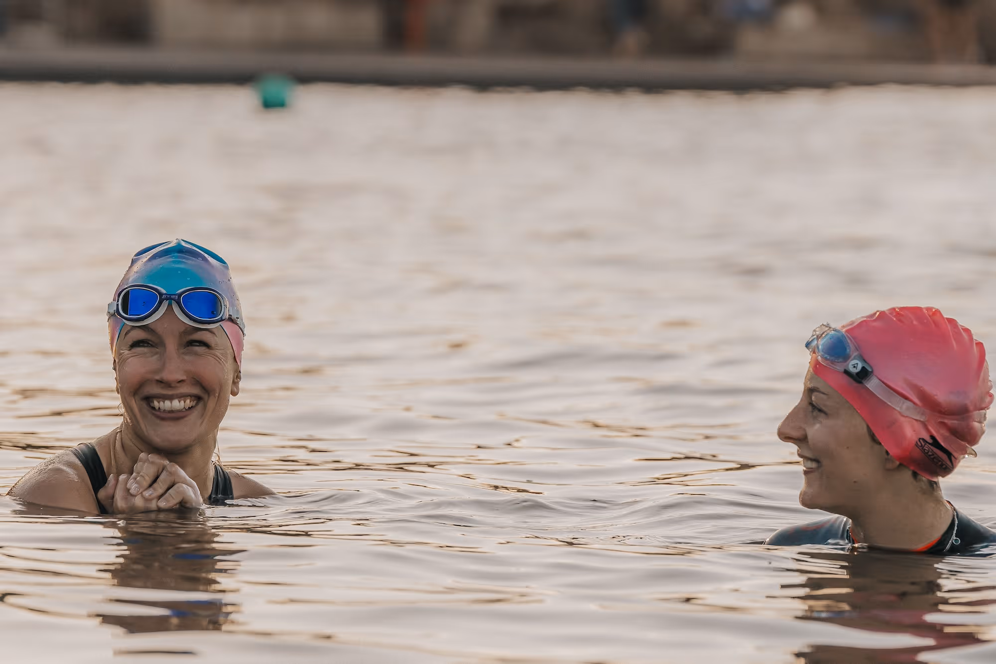 Open water swimming in crystal clear blue water