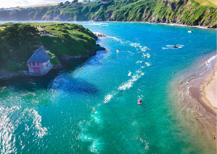 Three swimmers smiling at start of a Chillswim event
