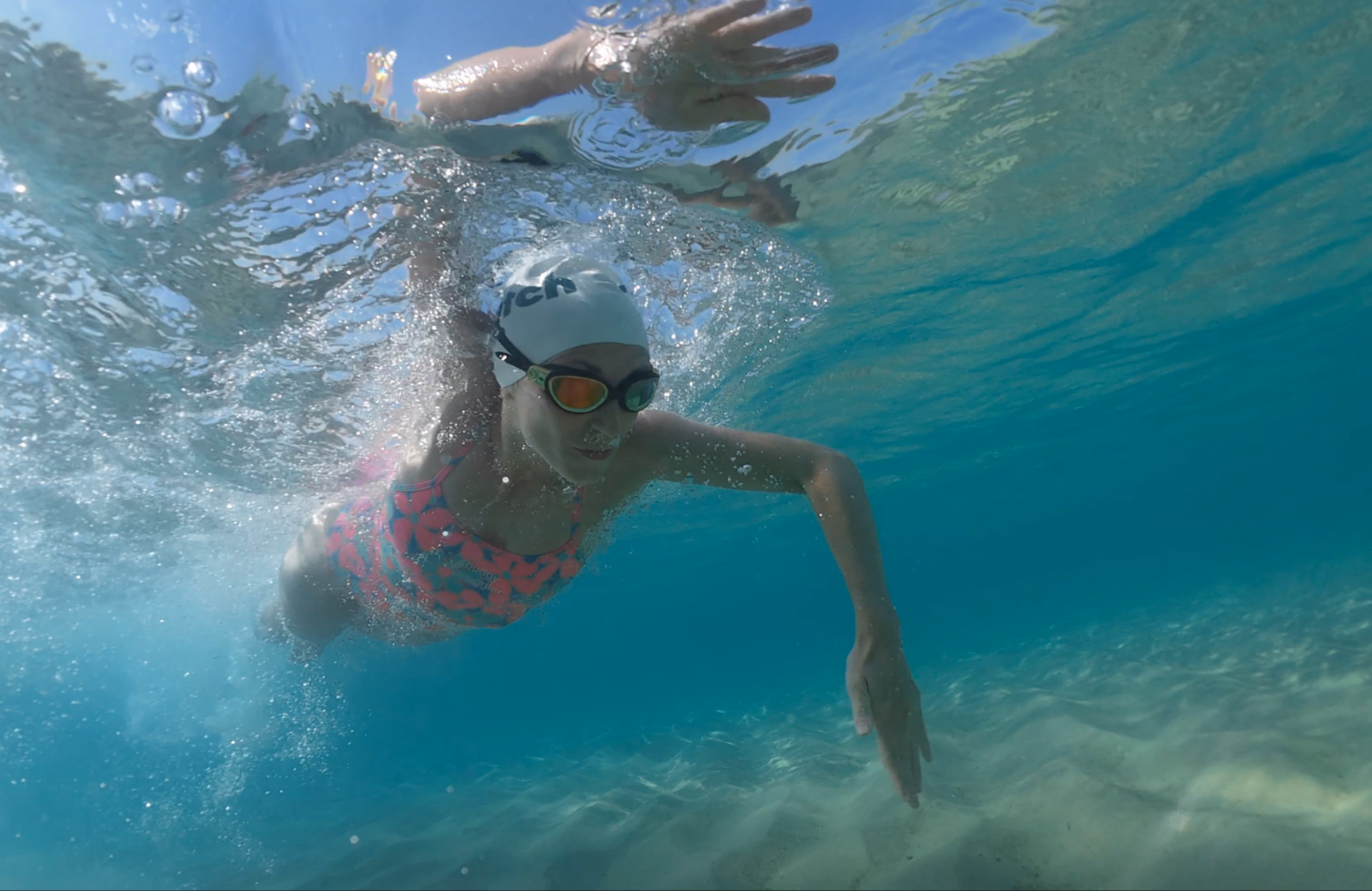 Underwater shot of swimmer in open water