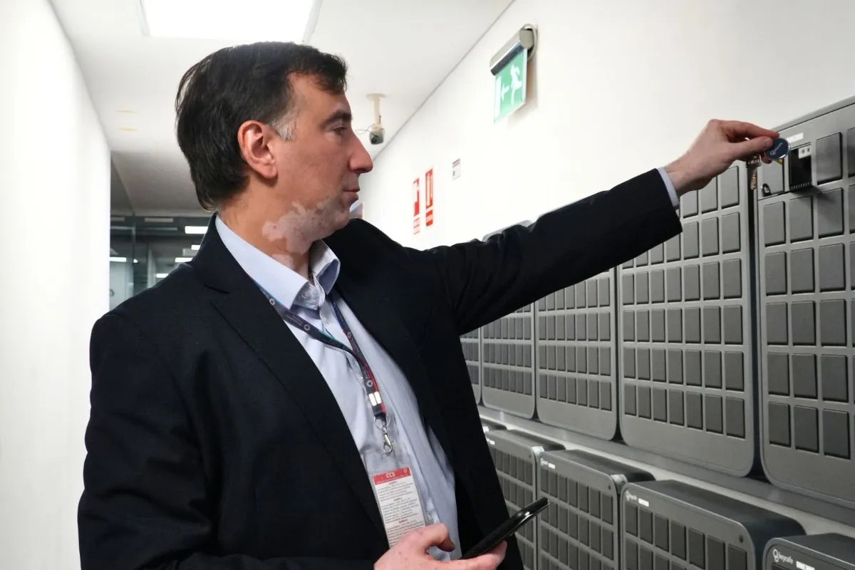 security assistant picking up a key